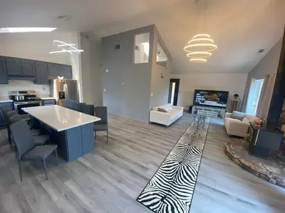 a large living room with a zebra rug on the floor at Scenic view villa near Yosemite in Groveland