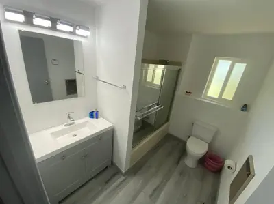 a bathroom with a sink and a toilet and a mirror at Scenic view villa near Yosemite in Groveland