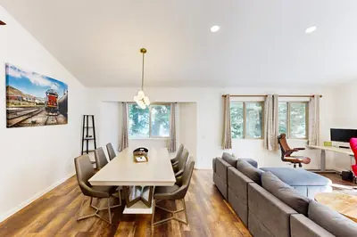 a living room with a couch and a table at Forest Grove in Kings Beach