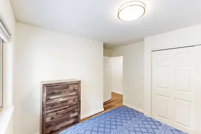 an empty room with a door and a blue rug at Forest Grove in Kings Beach