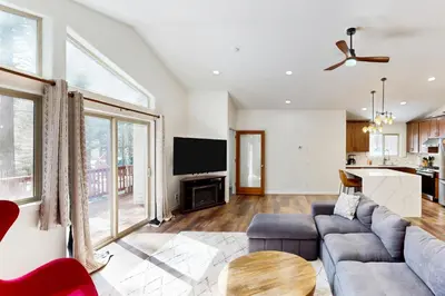 a living room with a couch and a table at Forest Grove in Kings Beach