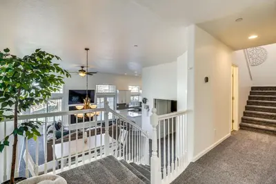a staircase in a living room with a ceiling at Theater Room, Fireplace Home 5 Mi to Dtwn Reno! in Sparks