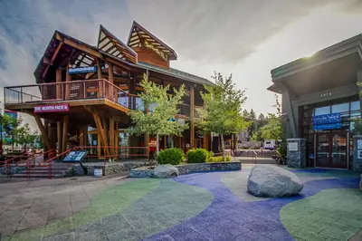 a large wooden building with a balcony at Making Waves, Unit B in Stateline