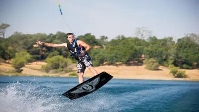 a man on a wake board in the water at Staybridge Suites Sacramento-Folsom by IHG in Folsom