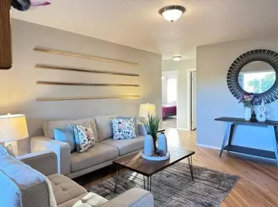 a living room with a couch and a table at Ripon Orchard Retreat in Ripon