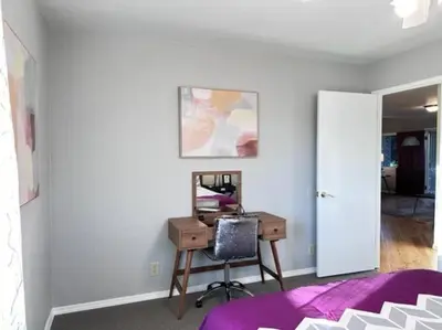 a bedroom with a desk with a computer on it at Ripon Orchard Retreat in Ripon
