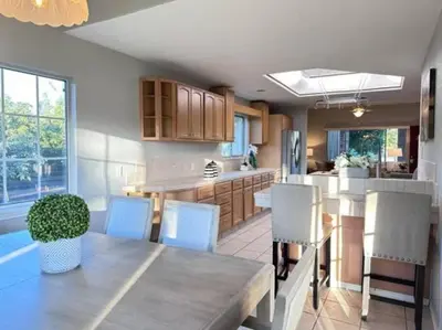 a kitchen and dining room with a table and chairs at Ripon Orchard Retreat in Ripon
