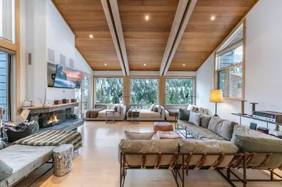 a living room with couches and a fireplace at Bright 5BD Alpine Retreat - 5Min to Alpine Meadows in Tahoe City