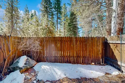 a wooden fence with snow on top of it at Take a Peak in Incline Village