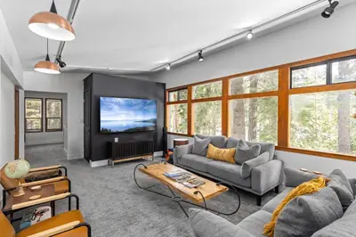a living room with a couch and a tv at Sunnyside Retreat - Tahoe City, 4 BR, Pet Friendly, Bonus Room in Tahoe City
