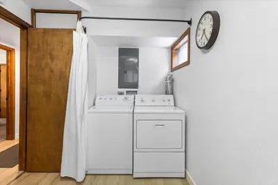 a kitchen with a stove and a clock on the wall at Sunnyside Retreat - Tahoe City, 4 BR, Pet Friendly, Bonus Room in Tahoe City