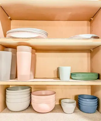 a shelf filled with plates and bowls and other dishes at Pickleball Retreat near Bass Lake & S. Yosemite in Ahwahnee