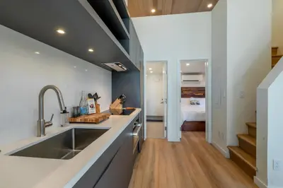 a kitchen with a sink and a counter top at Village Camp Truckee in Truckee
