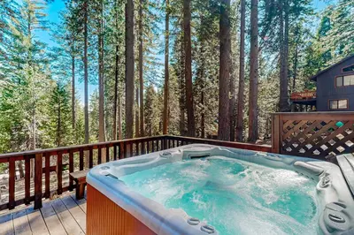 a hot tub on the deck of a house at Hot Tub Hideaway in Dorrington