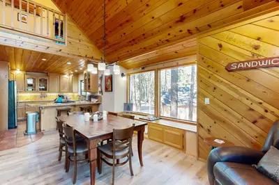a dining room and kitchen with a table and chairs at Hot Tub Hideaway in Dorrington