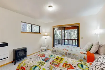 a bedroom with a bed and a fireplace at Hot Tub Hideaway in Dorrington