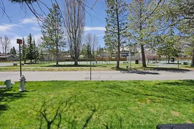 a park with a fire hydrant in the grass at Ala Wai BoulevardApartment 23 in Lake Valley