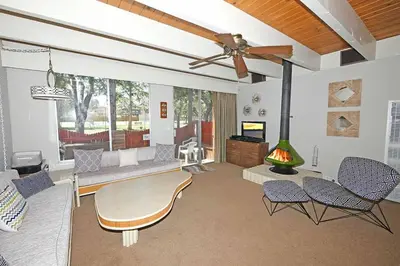 a living room with a couch and a fireplace at Ala Wai BoulevardApartment 23 in Lake Valley