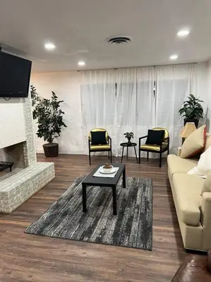 a living room with a couch and a coffee table at Sequoia Villa in Visalia