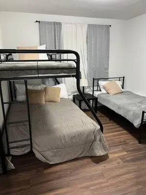 a room with two bunk beds in a room at Sequoia Villa in Visalia