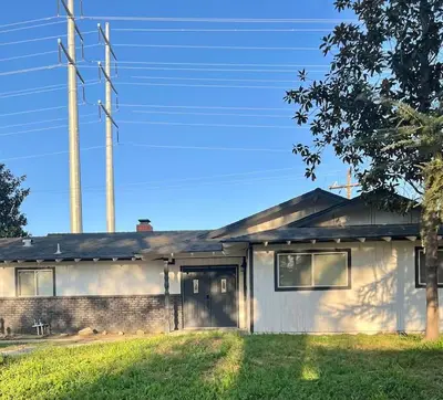 a brick house with a pole in front of it at Sequoia Villa in Visalia