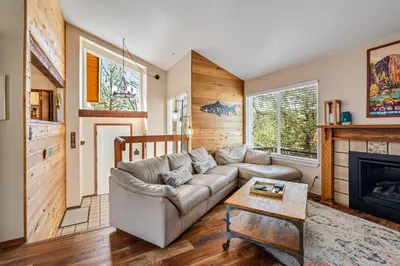 a living room with a couch and a fireplace at Kathy's Korner - Pet Friendy with Large Deck! home in Groveland