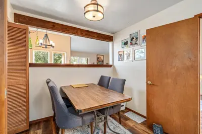 a dining room with a wooden table and chairs at Kathy's Korner - Pet Friendy with Large Deck! home in Groveland