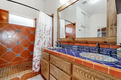 a bathroom with a sink and a mirror at Hot Tub and Expansive Views Copperopolis Mtn Home in Copper Cove Subdivision