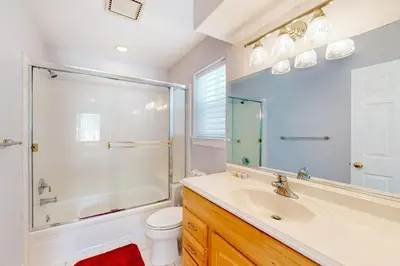 a bathroom with a shower and a sink and a toilet at Andria Grove in Stateline