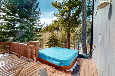 a bed on the deck of a house at Andria Grove in Stateline