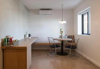 a kitchen with a table and chairs in a room at Best Bet Motor Lodge in Reno