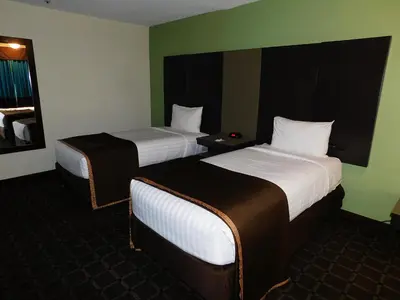 a hotel room with two beds and a window at Travelodge by Wyndham Angels Camp CA in Angels Camp
