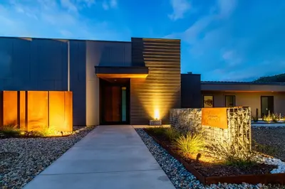 a modern house with a walkway in front of it at Horizon by Yosemite in Midpines