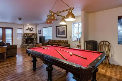 a living room with a pool table in it at Spring Wonderland in Yosemite West