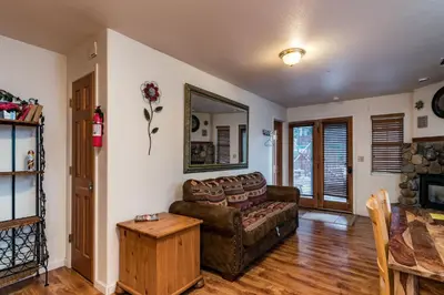 a living room with a couch and a table at Spring Wonderland in Yosemite West