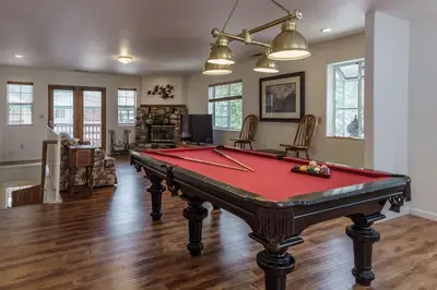 a living room with a pool table in it at Spring Wonderland in Yosemite West