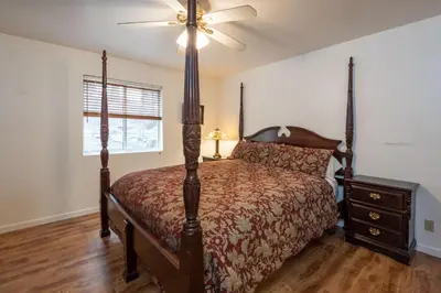 a bedroom with a bed and a ceiling fan at Lower Cascades in Yosemite West