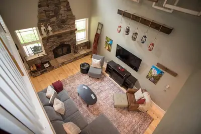 an overhead view of a living room with a couch and a fireplace at Yosemite Firehouse Inn in Mariposa