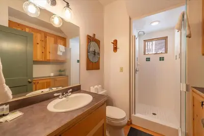 a bathroom with a sink and a toilet and a shower at Cozy Designer Decorated Cabin Near Slopes Fireplace Peekaboo Lakeview in Carnelian Bay