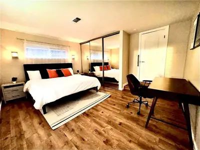 a bedroom with a bed and a desk and a piano at Sunrise View in Rocklin