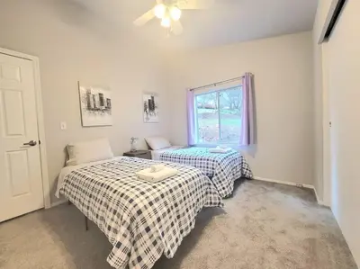 a bedroom with two beds and a window at Home in Groveland near Yosemite NP in Groveland