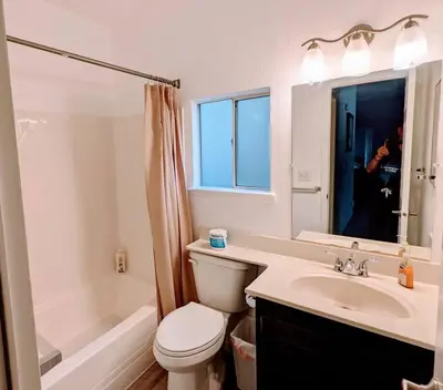 a person taking a picture of a bathroom at Home in Groveland near Yosemite NP in Groveland