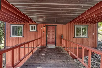 a red house with a red door and windows at Carnelian Bay 4BD Near Beach & Slopes in Carnelian Bay