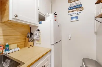 a kitchen with a refrigerator and a wooden counter top at Tahoe Heavenly Hideaway in Stateline