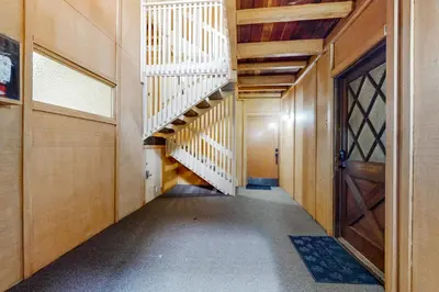 an empty hallway with stairs and a door at Tahoe Heavenly Hideaway in Stateline