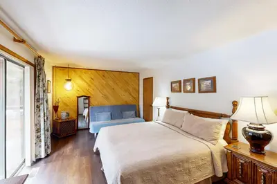 a bedroom with a large bed and a window at Scenes of Evergreens in Incline Village