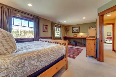 a bedroom with a bed and a tv in a room at Private Patio and Gas Grill Stunning Truckee Home in Truckee