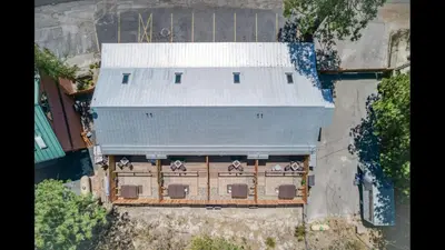 an overhead view of a building with a white roof at #2 Cottage Like Suite With Private Hot Tub in Bass Lake