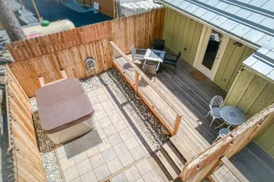 an overhead view of a deck with a table and chairs at #4 Cottage Like Suite with Private Hot Tub in Bass Lake