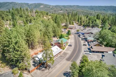 an aerial view of a small town with a road at #4 Cottage Like Suite with Private Hot Tub in Bass Lake
